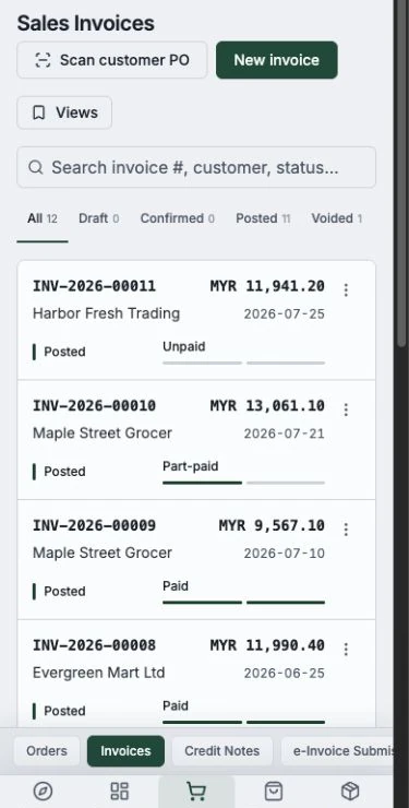 The Sales module showing sample invoices and payment statuses in a mobile browser.